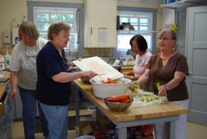 HPC volunteers preparing a meal